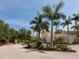 Attractive community entrance with palm trees and a well-maintained landscape at 249 Rio Terra, Venice, FL 34285