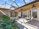Outdoor patio with seating area, plants, and a glass ceiling at 249 Rio Terra, Venice, FL 34285
