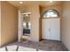 Inviting entryway with tile flooring, a door to a bedroom, and double doors to the interior at 249 Rio Terra, Venice, FL 34285
