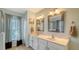 Elegant bathroom with double vanity and a large mirror at 250 Long Meadow Ln, Rotonda West, FL 33947