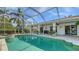 Relaxing pool area with patio and kitchen access at 250 Long Meadow Ln, Rotonda West, FL 33947