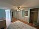 Spacious bedroom with mirrored closet doors and a queen-size bed at 269 Outer Dr, Venice, FL 34285