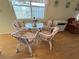 Small dining area with wicker table and chairs at 269 Outer Dr, Venice, FL 34285