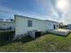 Mobile home exterior view, showing the AC unit at 269 Outer Dr, Venice, FL 34285