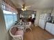 Eat-in kitchen with wood floors and white cabinets at 269 Outer Dr, Venice, FL 34285