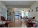 Living room with mauve sofas and wood floors at 269 Outer Dr, Venice, FL 34285
