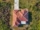 Bird's-eye view of a house with a red tile roof and spacious yard at 3162 Cordova Ter, North Port, FL 34291