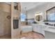Elegant bathroom with a soaking tub, walk-in shower, and double vanity at 3162 Cordova Ter, North Port, FL 34291