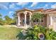 Beautiful one-story home with a tiled roof, columns, and lush landscaping at 3162 Cordova Ter, North Port, FL 34291