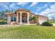 Attractive one-story home with a tile roof, columns, and landscaped lawn at 3162 Cordova Ter, North Port, FL 34291