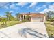 House exterior with two-car garage and manicured lawn at 3162 Cordova Ter, North Port, FL 34291
