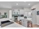 Island kitchen with white cabinets, stainless steel appliances, and a breakfast bar at 3162 Cordova Ter, North Port, FL 34291