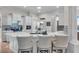 Eat-in kitchen with white cabinets, quartz countertops, and breakfast bar at 3162 Cordova Ter, North Port, FL 34291