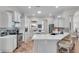 Spacious kitchen with white cabinets, large island, and stainless steel appliances at 3162 Cordova Ter, North Port, FL 34291