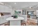 Modern kitchen with white cabinetry, a large island, and breakfast bar at 3162 Cordova Ter, North Port, FL 34291