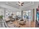 Relaxing living room with gray sofas and a large TV at 3162 Cordova Ter, North Port, FL 34291