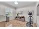 Home office with built-in shelving, desk, and elliptical machine at 3162 Cordova Ter, North Port, FL 34291