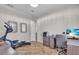 Bright home office with a desk, printer and elliptical machine at 3162 Cordova Ter, North Port, FL 34291