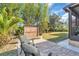 Patio furniture with seating for two and potted plants at 3162 Cordova Ter, North Port, FL 34291
