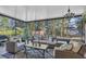 Screened porch with wicker furniture and chandelier at 3162 Cordova Ter, North Port, FL 34291