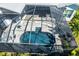 Aerial view of the screened-in pool, showcasing its design and integration with the outdoor space at 340 N River Rd, Venice, FL 34293