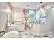 Elegant bathroom with marble accents, walk-in shower, and a large vanity with ample counter space at 340 N River Rd, Venice, FL 34293