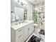 Bathroom featuring marble flooring, a sleek vanity, and a glass-enclosed shower with elegant design at 340 N River Rd, Venice, FL 34293