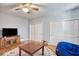 Neutral bedroom features hardwood floors, ceiling fan, and dual closets at 340 N River Rd, Venice, FL 34293