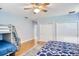 Bright bedroom features hardwood floors, ceiling fan, and multiple closets at 340 N River Rd, Venice, FL 34293