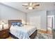 Bedroom featuring a ceiling fan, natural light, and soft decor with hardwood flooring at 340 N River Rd, Venice, FL 34293