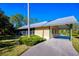 Single story home boasts a carport and screened in patio at 340 N River Rd, Venice, FL 34293