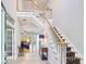 Grand foyer with staircase, soaring ceilings, and an open floor plan at 340 N River Rd, Venice, FL 34293