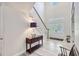 Bright foyer featuring high ceilings, decorative front doors and a staircase at 340 N River Rd, Venice, FL 34293