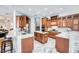 Spacious kitchen featuring wood cabinets, marble counters and stainless steel appliances at 340 N River Rd, Venice, FL 34293
