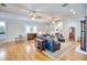 Spacious living room featuring hardwood floors, comfortable seating, and ample lighting at 340 N River Rd, Venice, FL 34293