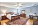Spacious main bedroom offers natural light, ceiling fan, and wooden furniture at 340 N River Rd, Venice, FL 34293