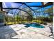 A sparkling pool sits within a screened enclosure, offering a private and tranquil outdoor space at 340 N River Rd, Venice, FL 34293