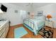 Guest bedroom with wood floors, queen-size bed, and updated furnishings at 340 Three Lakes Ln # K, Venice, FL 34285