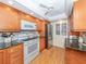 Modern kitchen with granite countertops and stainless steel appliances at 340 Three Lakes Ln # K, Venice, FL 34285