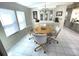 Bright dining area features tile flooring and a built in hutch with serving area at 346 Mariner Dr, North Port, FL 34287