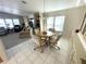Cozy dining area features a round table, four chairs, and a chandelier at 346 Mariner Dr, North Port, FL 34287