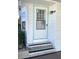 Welcoming front entrance with steps and detailed trim at 346 Mariner Dr, North Port, FL 34287