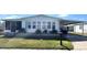 Charming single-story home with a covered carport and well-maintained lawn at 346 Mariner Dr, North Port, FL 34287