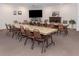 Well-lit meeting room featuring comfortable seating, a fireplace, and a large TV for presentations at 346 Mariner Dr, North Port, FL 34287