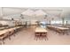 Spacious room offering ample seating for various events and gatherings with neutral walls and lighting at 346 Mariner Dr, North Port, FL 34287
