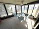 Inviting sunroom with a glass table, chairs, and natural light, creating a relaxing atmosphere at 346 Mariner Dr, North Port, FL 34287
