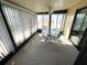 Charming sunroom with glass table and chairs, perfect for relaxing at 346 Mariner Dr, North Port, FL 34287