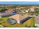 A high aerial view of a backyard featuring a screened-in pool and well-maintained landscaping at 357 Marsh Creek Rd, Venice, FL 34292
