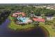 An aerial view of the community pool, situated near a lake at 357 Marsh Creek Rd, Venice, FL 34292