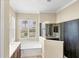 Bathroom featuring double sinks, a soaking tub, and a separate shower with glass surround at 357 Marsh Creek Rd, Venice, FL 34292